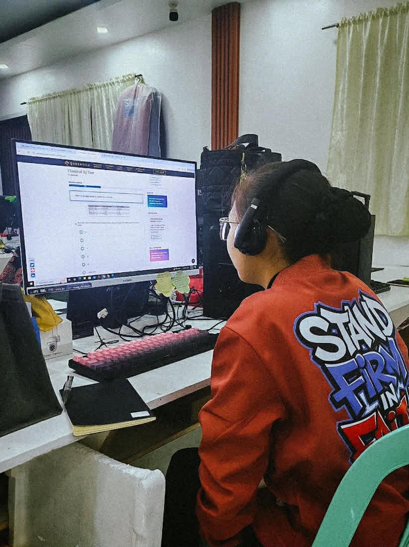 An AHMVAS trainee gaining guided experience at a working computer station